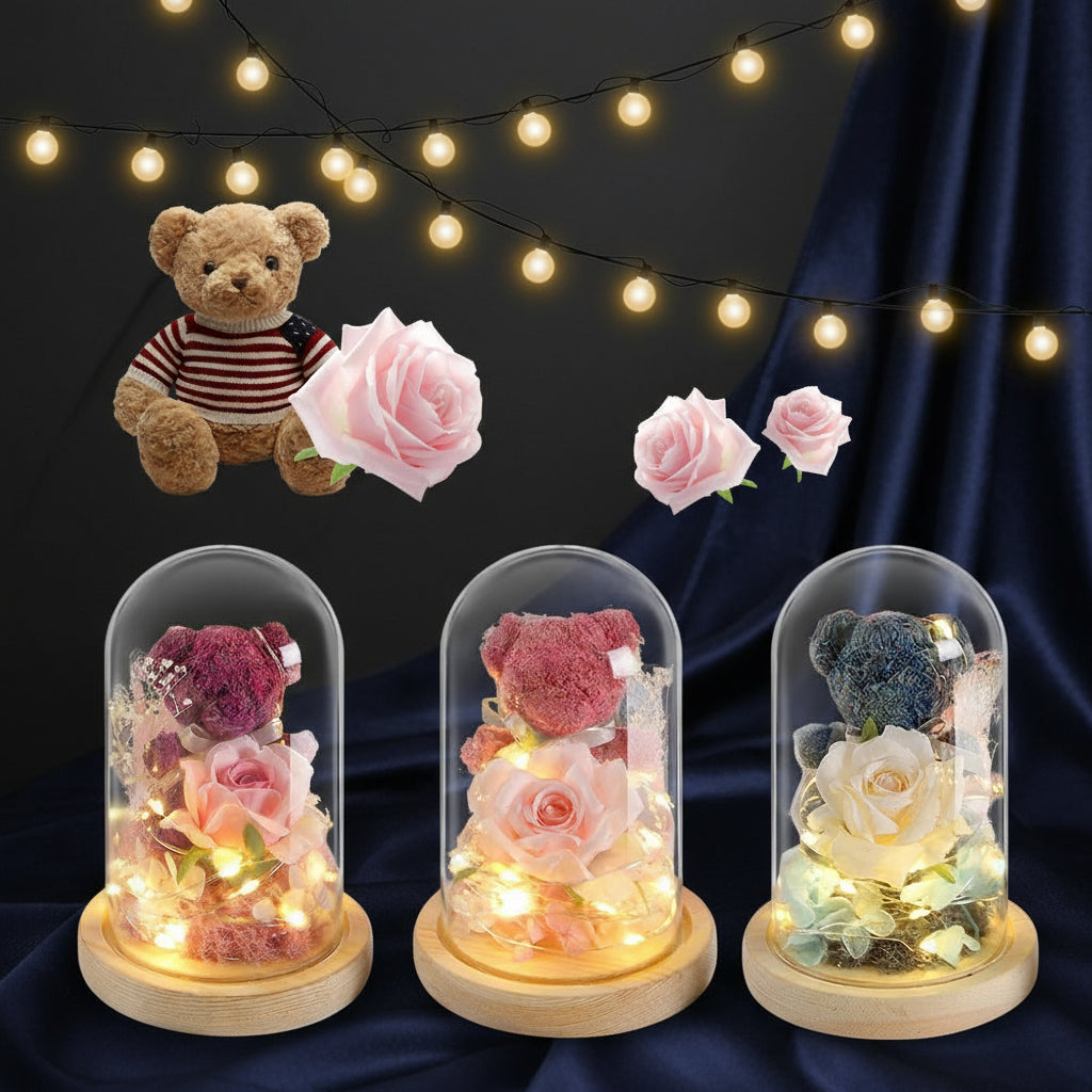 Three glass dome lights with teddy bears and flowers, string lights in the background.